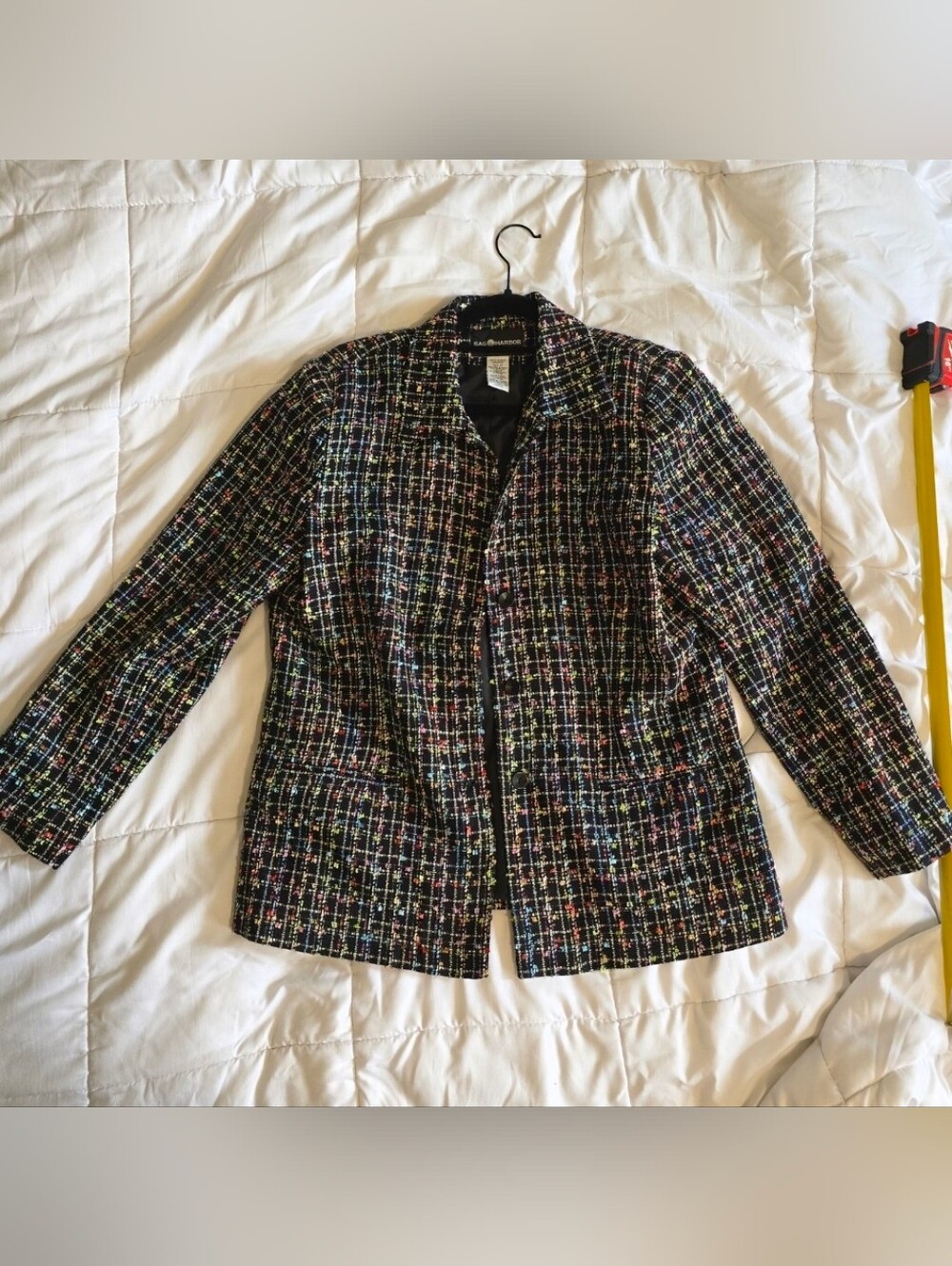 This vintage Sag Harbor blazer features a black tweed fabric